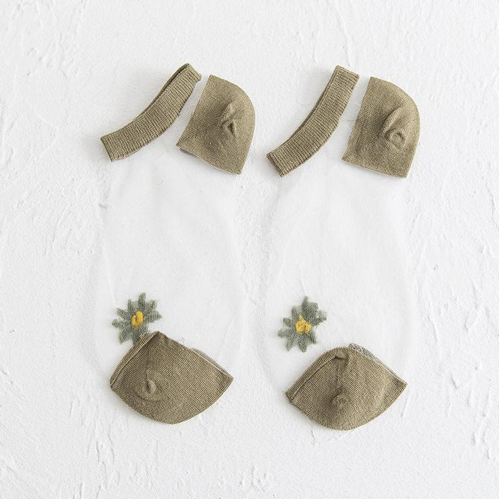 Vibrant women's ankle socks showcasing a playful daisy floral print, excellent for casual wear