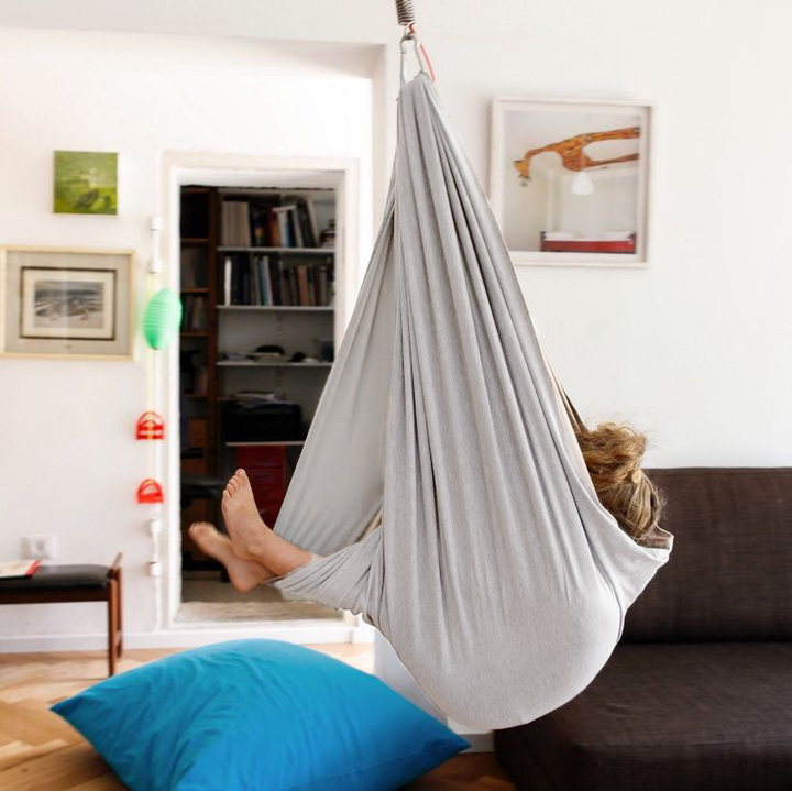 "Calming therapy hammock for children in soothing colors, enhances relaxation, emotional calmness, and motor skills."