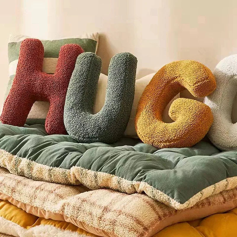 "Colorful alphabet cushion with cotton cover, ideal for home decoration or kids' rooms, adds playful elegance and comfort."