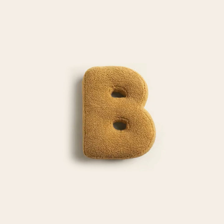 "Colorful alphabet cushion with cotton cover, ideal for home decoration or kids' rooms, adds playful elegance and comfort."