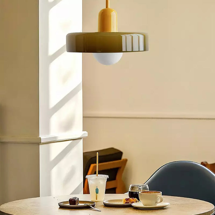 "Colourful glass pendant lamp in Bauhaus style featuring red, green, pink, and yellow stained glass for artistic decor."