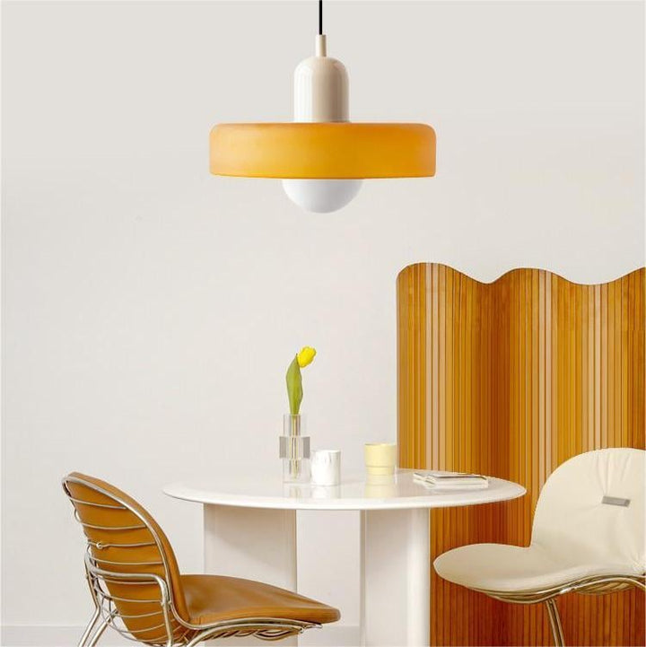 "Colourful glass pendant lamp in Bauhaus style featuring red, green, pink, and yellow stained glass for artistic decor."