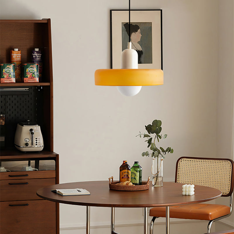 "Colourful glass pendant lamp in Bauhaus style featuring red, green, pink, and yellow stained glass for artistic decor."