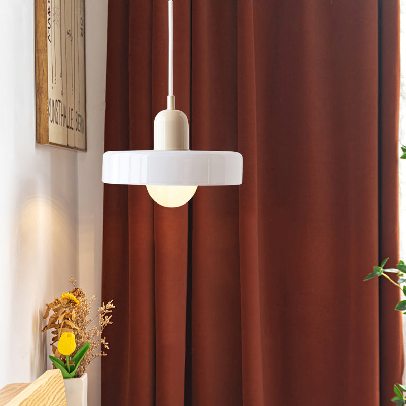 "Colourful glass pendant lamp in Bauhaus style featuring red, green, pink, and yellow stained glass for artistic decor."