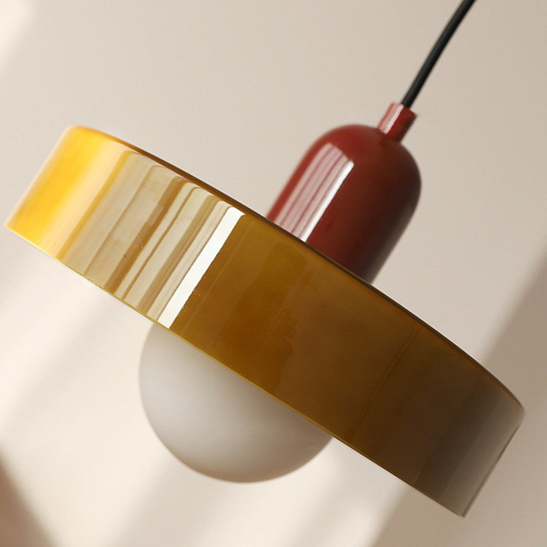 "Colourful glass pendant lamp in Bauhaus style featuring red, green, pink, and yellow stained glass for artistic decor."