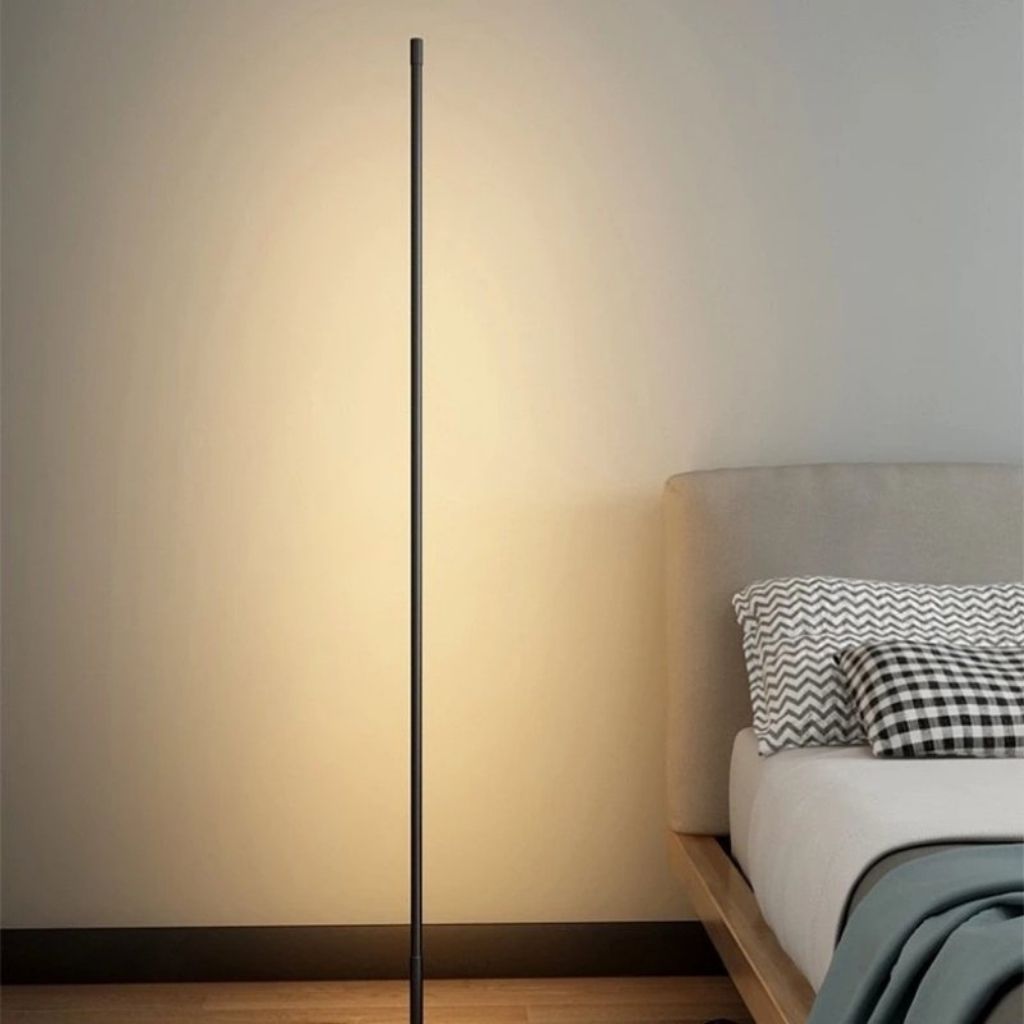 Elegant LED floor lamp with adjustable soft glow, minimalist design in aluminum and acrylic, ideal for modern living rooms.