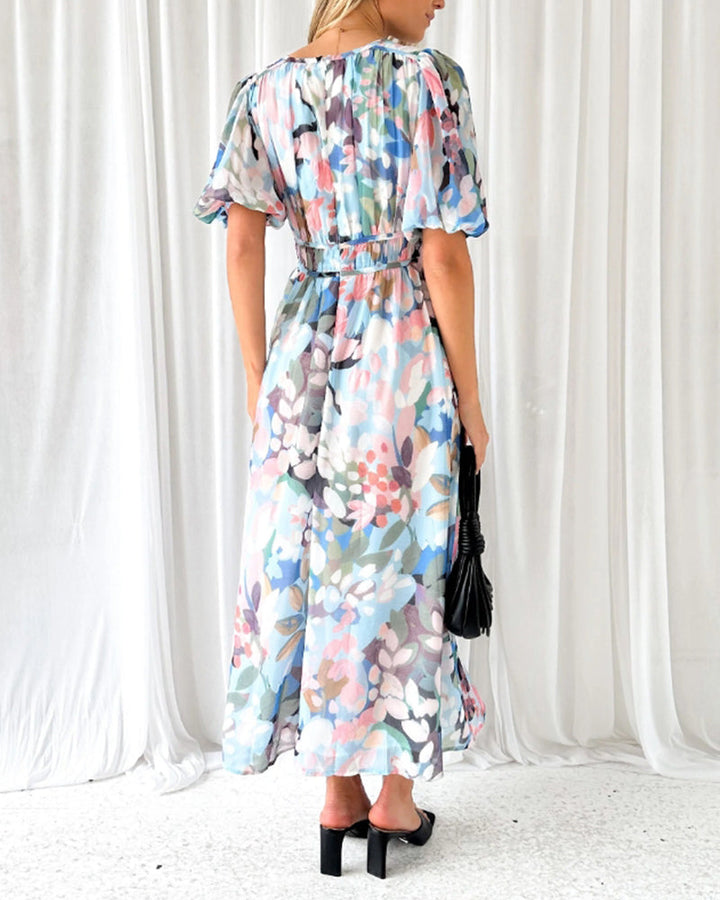 Elegant floral maxi dress with vibrant patterns, graceful flow, and versatile design for any formal occasion or event.