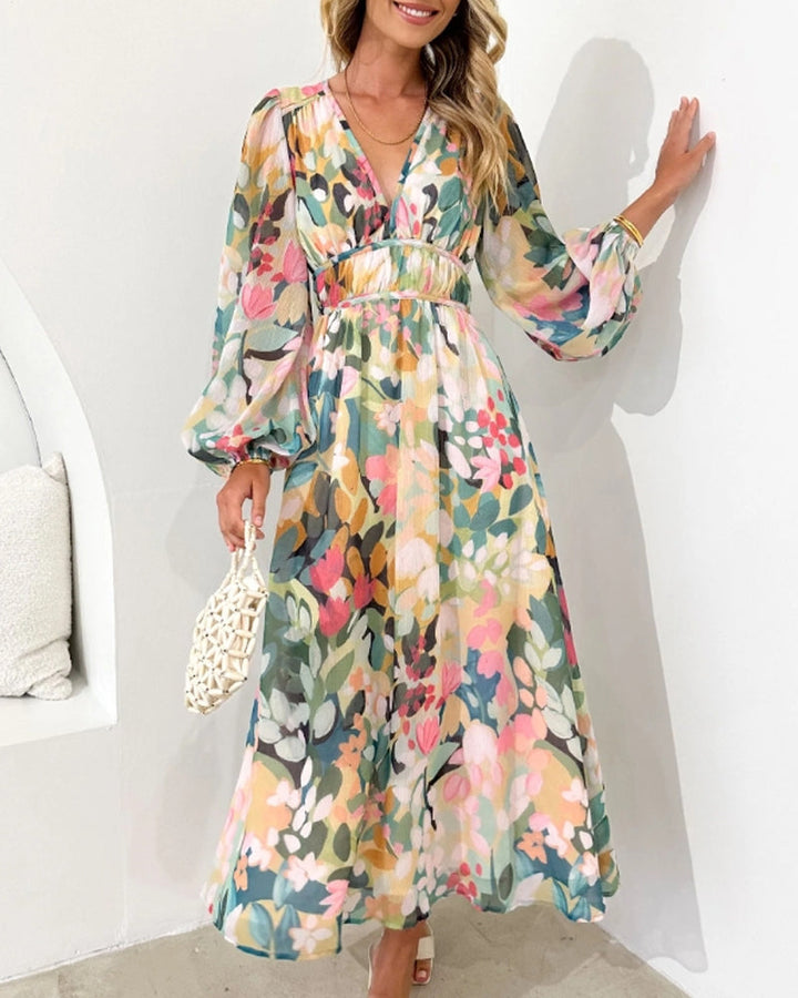 Elegant floral maxi dress with vibrant patterns, graceful flow, and versatile design for any formal occasion or event.