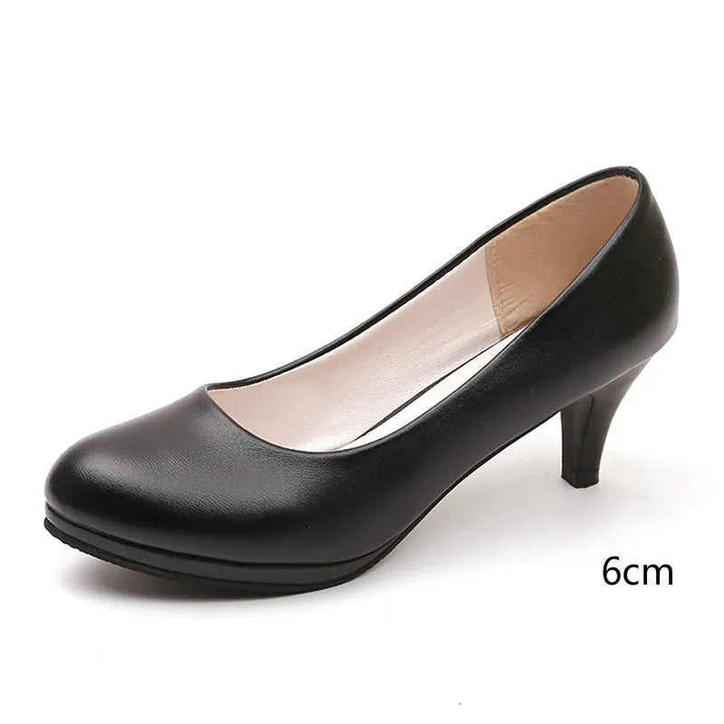 "Elegant orthopedic black women's pumps, sleek design with cushioned support for style and comfort."