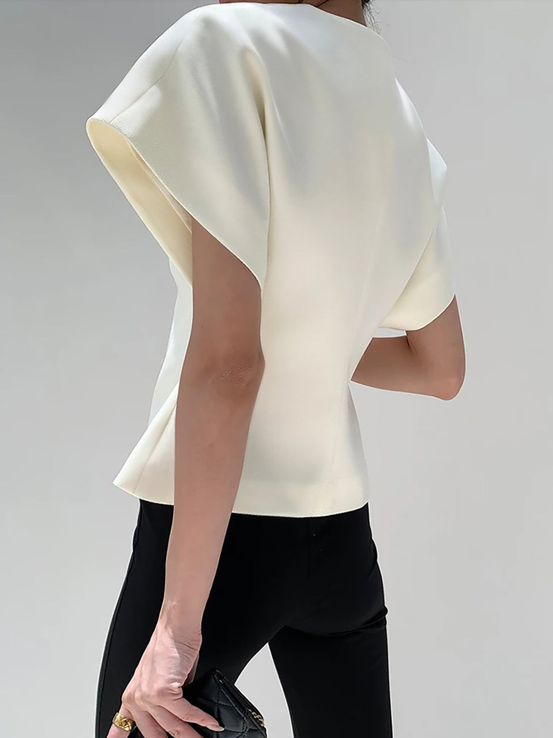 "Elegant women's V-neck blouse with buttons, tailored fit, chic button-down design, ideal for versatile stylish outfits."