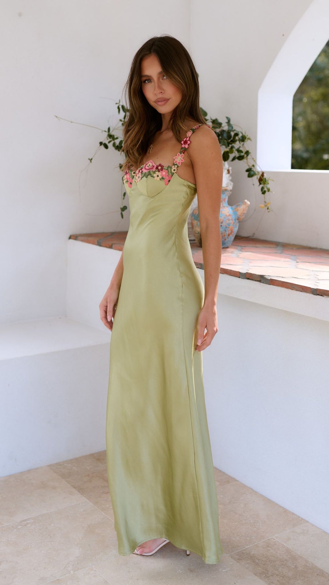 Elegant women's floral maxi dress with intricate botanical print, featuring a floor-length flowing silhouette for all occasio