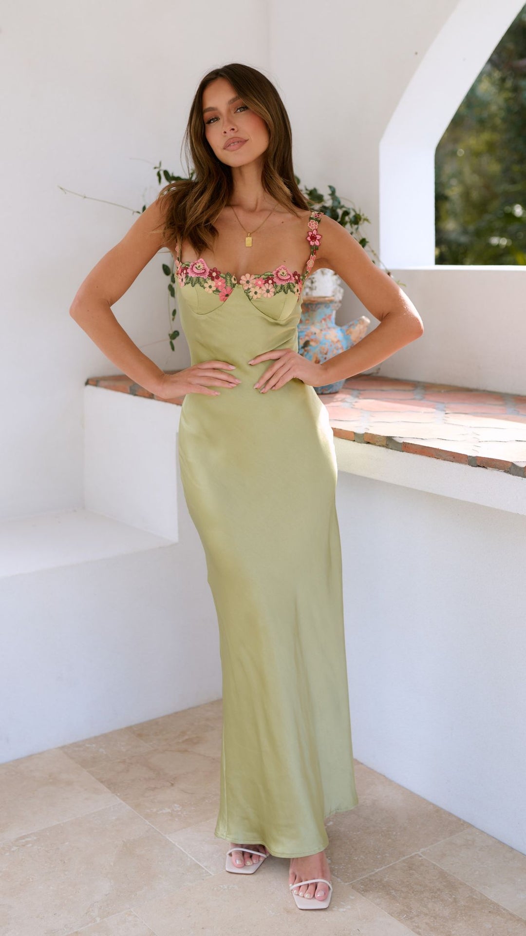 Elegant women's floral maxi dress with intricate botanical print, featuring a floor-length flowing silhouette for all occasio