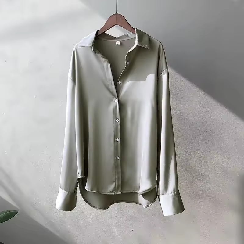 Elegant women's silk blouse with smooth texture; lightweight, versatile design in multiple colors. Perfect for any occasion.