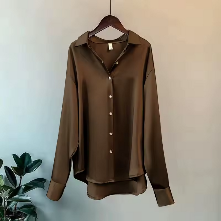 Elegant women's silk blouse with smooth texture; lightweight, versatile design in multiple colors. Perfect for any occasion.