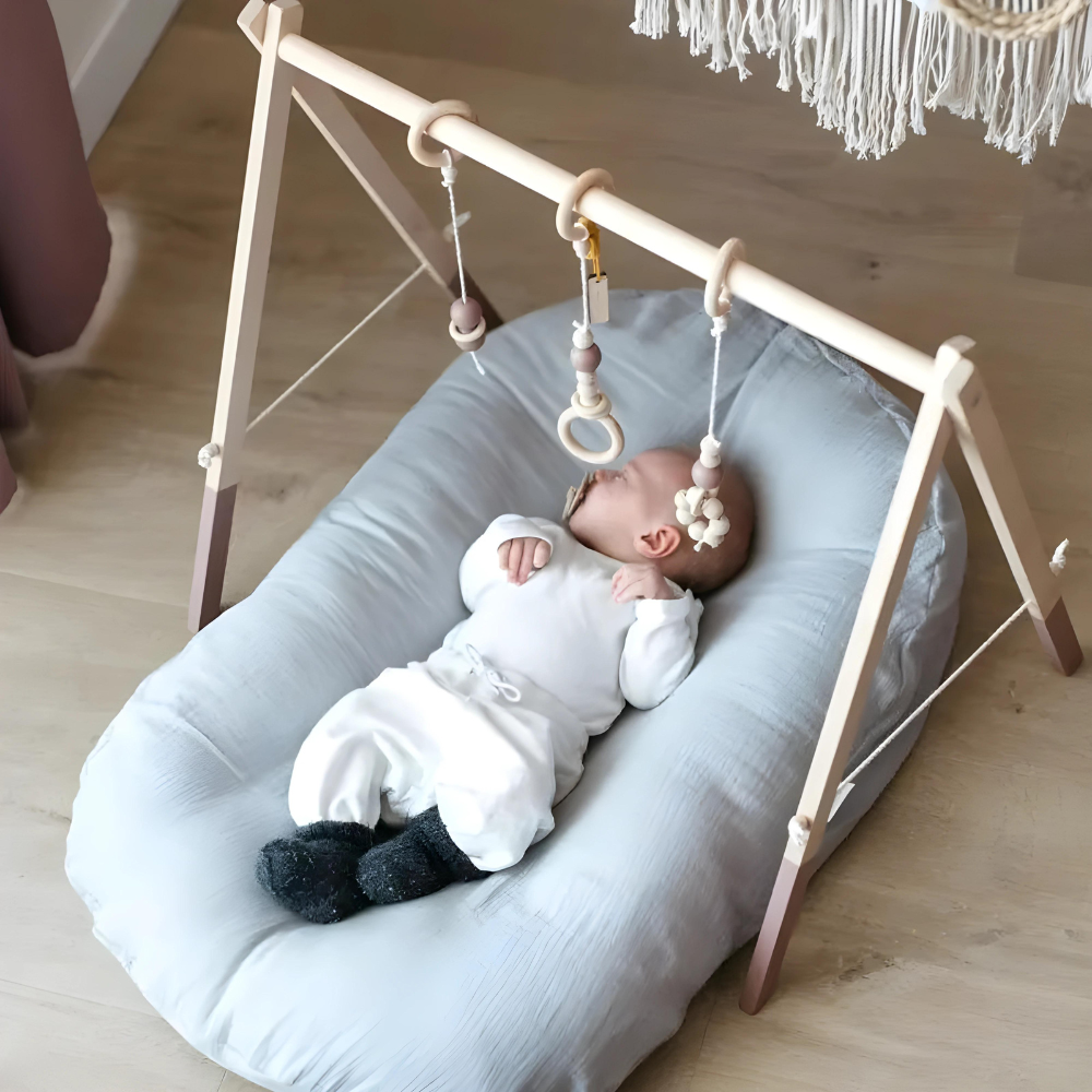 Ergonomic Breathable Baby Pillow in pink, green, and brown; hypoallergenic, provides head support, prevents flat head.