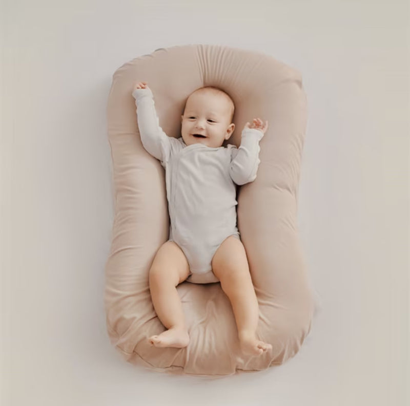 Ergonomic Breathable Baby Pillow in pink, green, and brown; hypoallergenic, provides head support, prevents flat head.