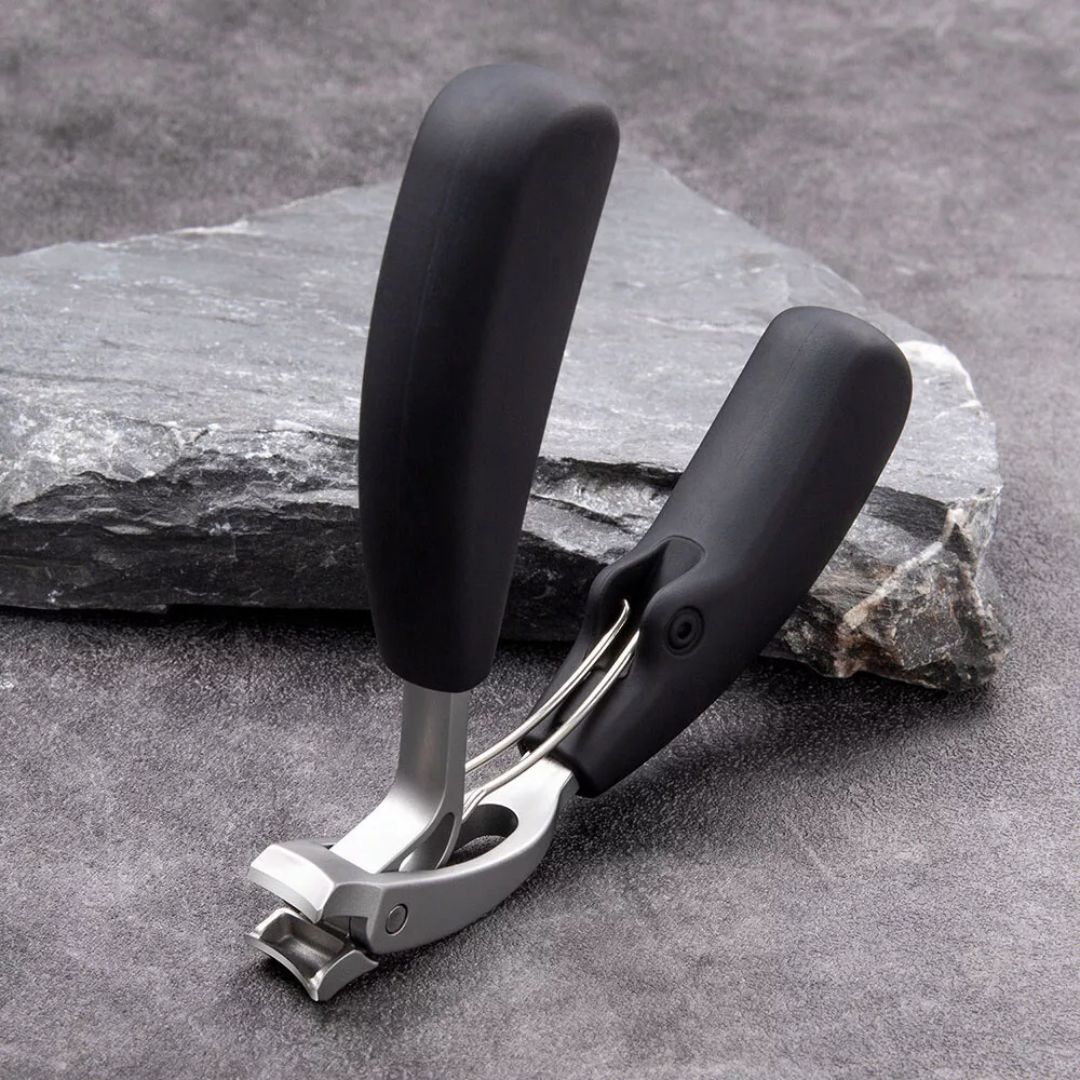 Ergonomic stainless steel nail clipper with matte black finish, precision blades, and non-slip grip for precise nail grooming