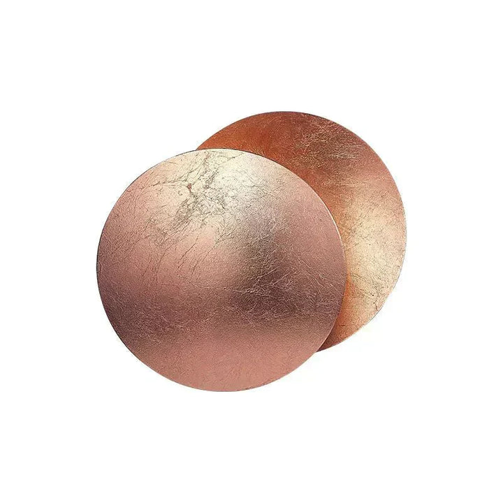 "Golden Solaris Wall Lamp with eclipse-inspired design, featuring elegant gold discs and warm LED glow for home decor."