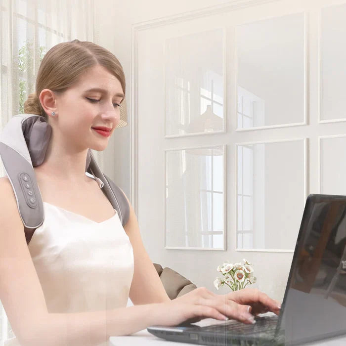 Heated neck and shoulder massager for deep relaxation, mimics human hands, portable, with adjustable heat and intensity.