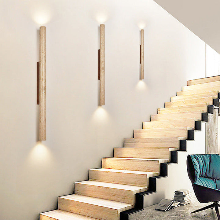 Japandi minimalist travertine stone wall lamp with natural beige finish, conveys elegance with its sleek design and warm glow