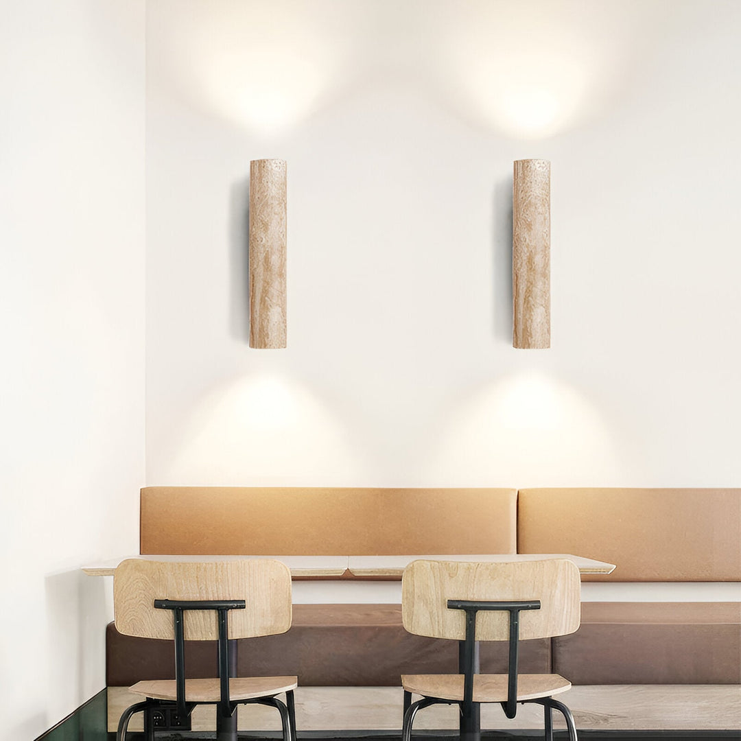 Japandi minimalist travertine stone wall lamp with natural beige finish, conveys elegance with its sleek design and warm glow
