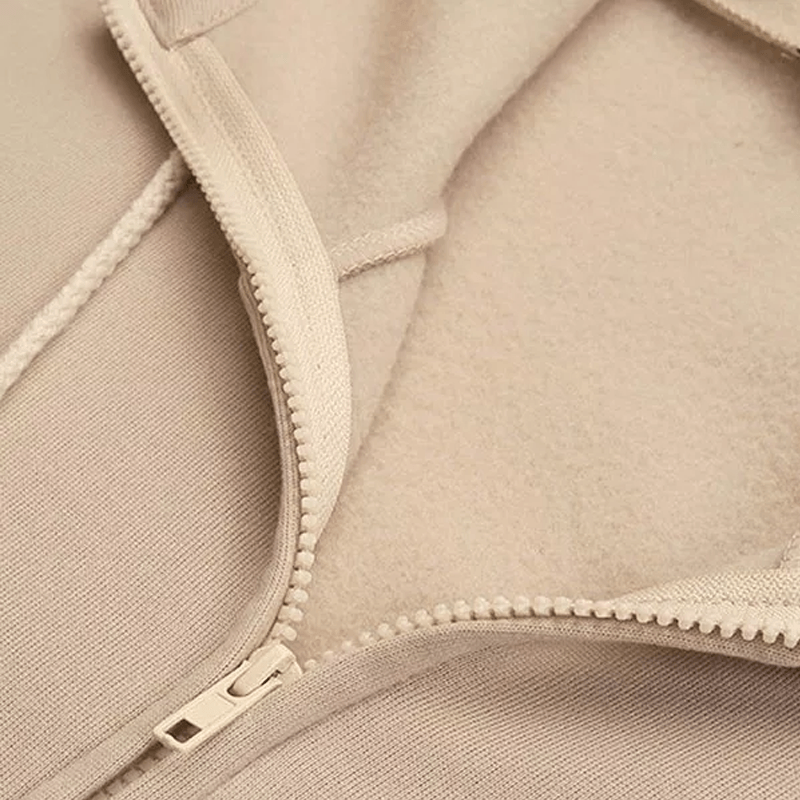 Khaki women's hooded vest jacket with pocket, featuring a front zipper and soft polyester fabric for comfort and style.