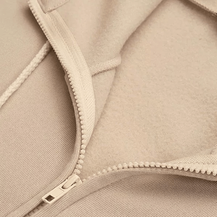 Khaki women's hooded vest jacket with pocket, featuring a front zipper and soft polyester fabric for comfort and style.