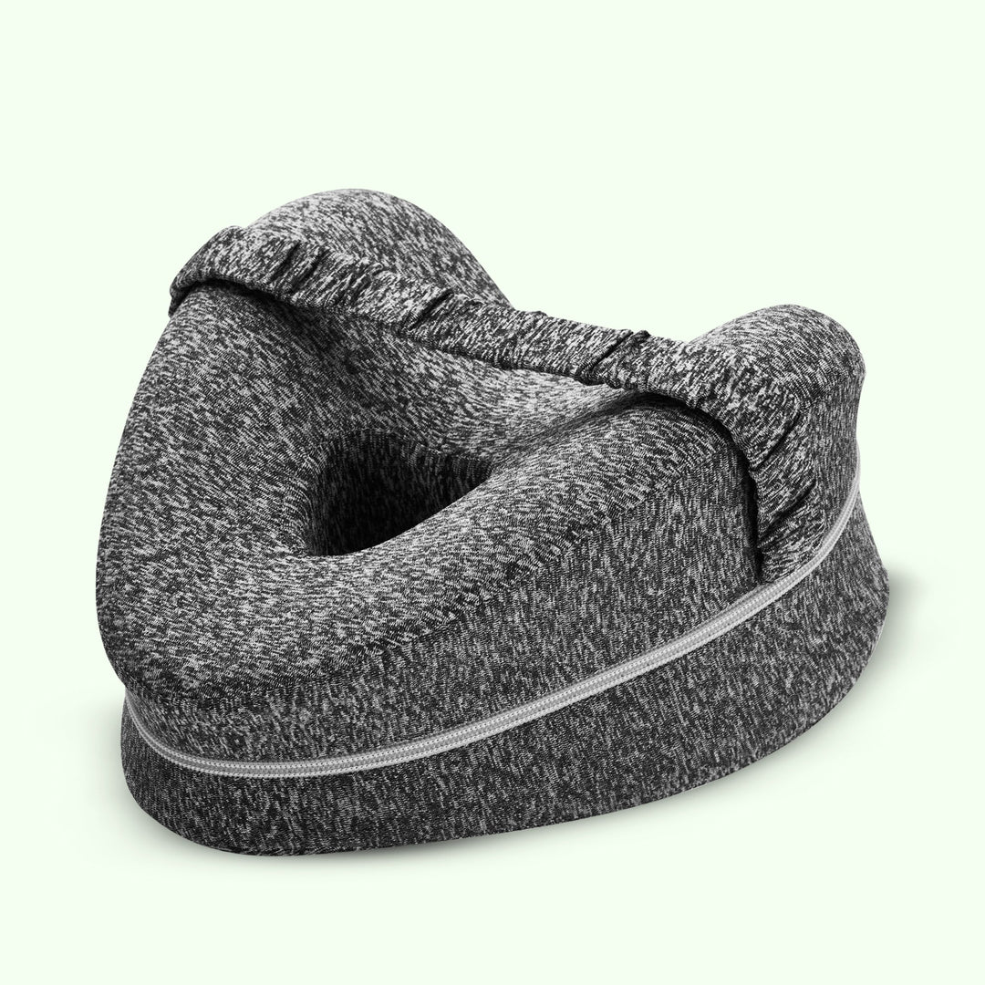 "Memory foam leg and knee support pillow in grey, pink, and white for pain relief, shown in various color options."