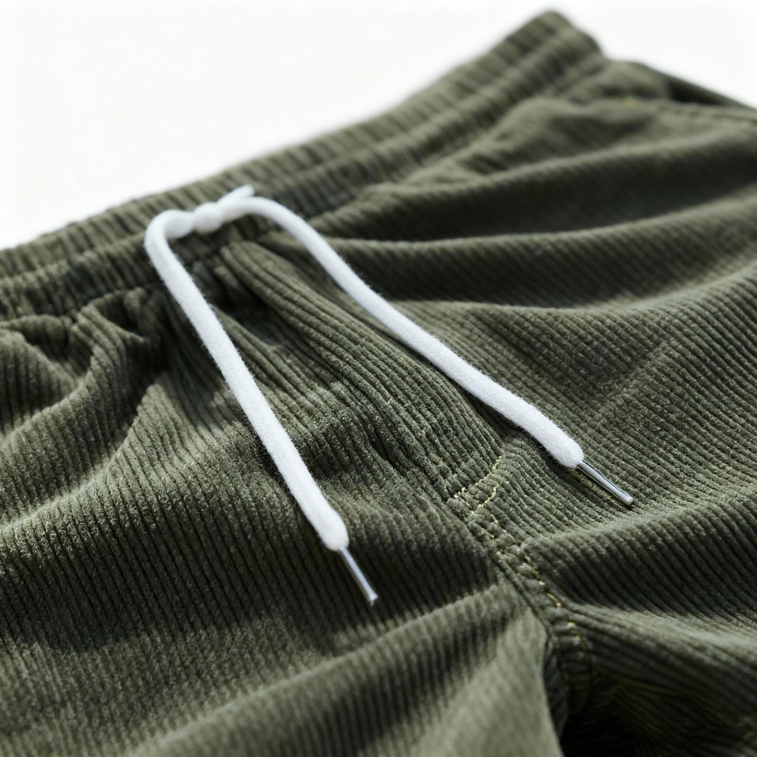 Men's casual swim shorts with elastic waistband, above-the-knee length, side pockets, and drawstring for adjustable fit.