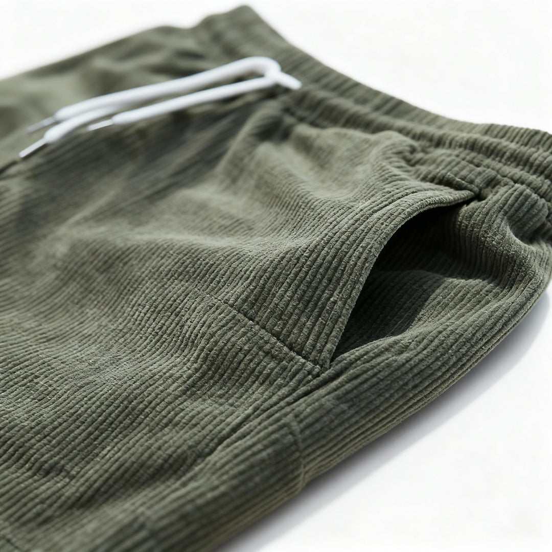 Men's casual swim shorts with elastic waistband, above-the-knee length, side pockets, and drawstring for adjustable fit.