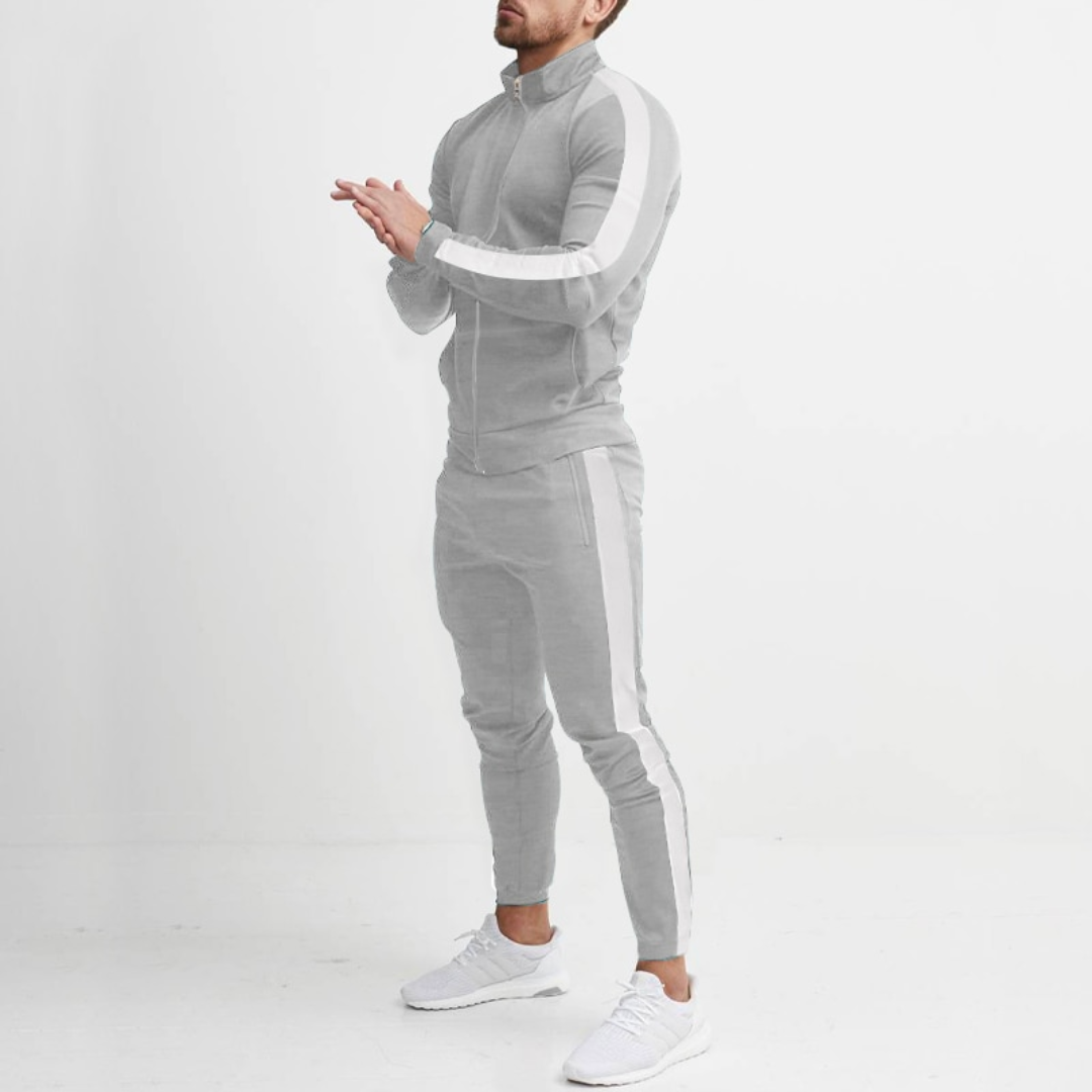 Men's luxury jogging set in grey, made from smooth polyester, featuring a tailored modern fit and elastic waistband.