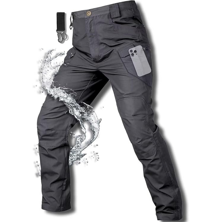 Men's waterproof fleece-lined tactical trousers with ten pockets, reinforced knees, shown outdoors for extreme weather use.