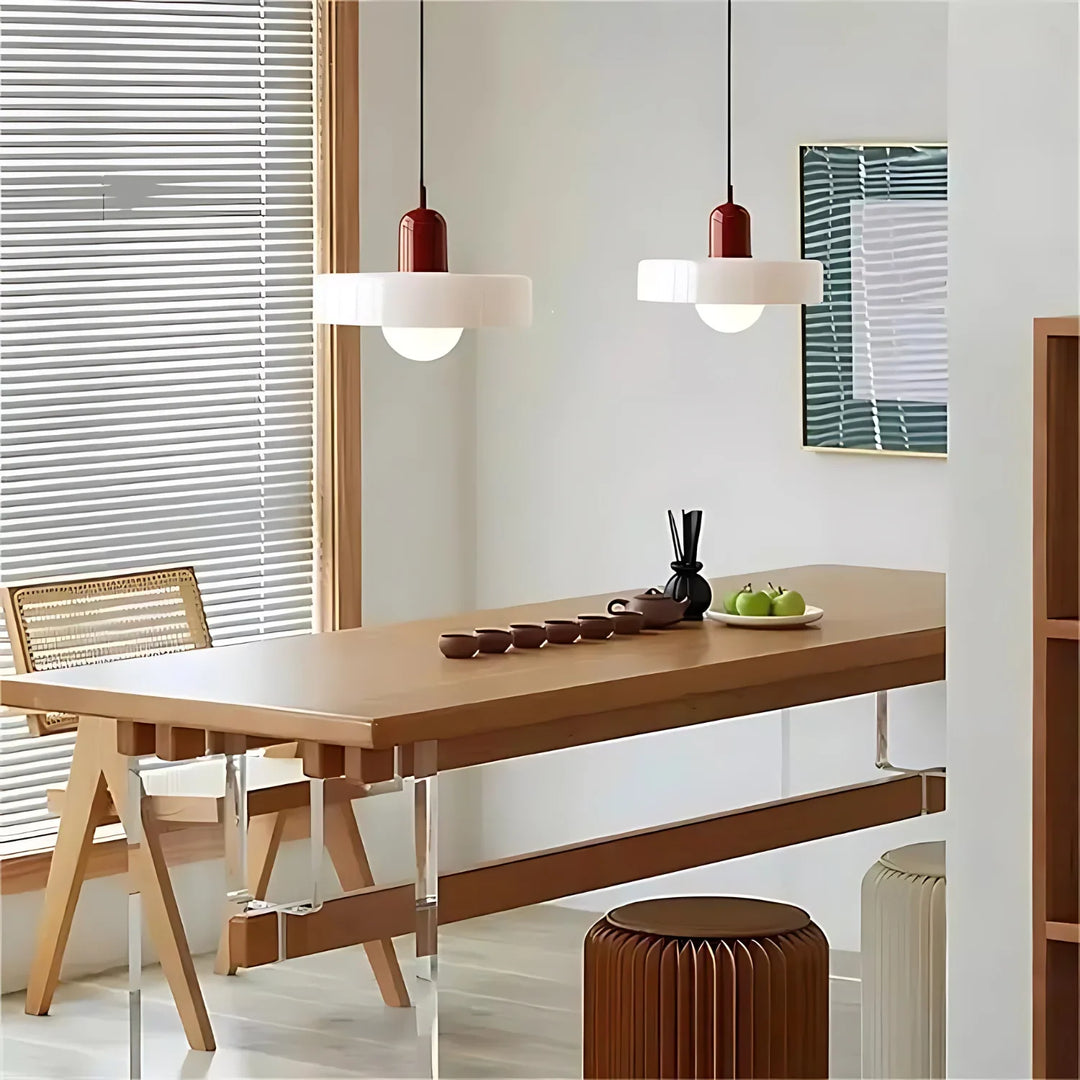 "Modern glass pendant light with sleek glass, brushed metal, ideal for elegant interiors, adds sophistication and warmth."