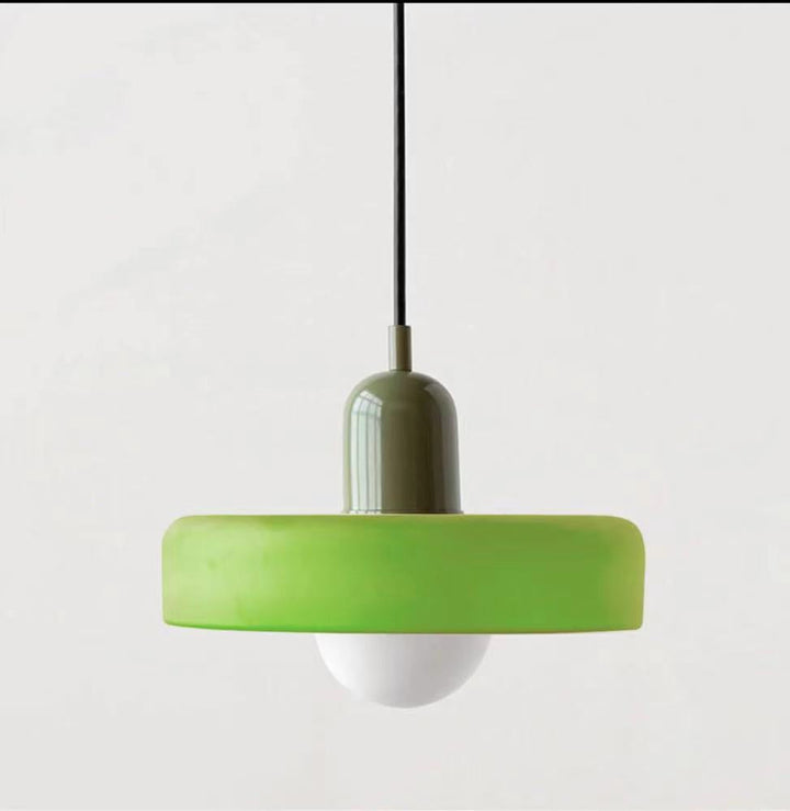 "Modern glass pendant light with sleek glass, brushed metal, ideal for elegant interiors, adds sophistication and warmth."