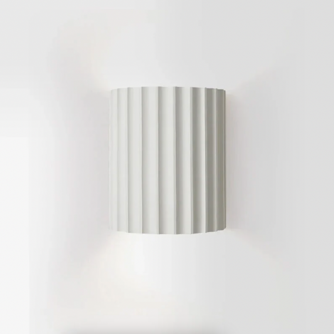 Modern resin wall lamp with artistic design, soft LED lighting, in white, green, grey, or orange for stylish home decor.