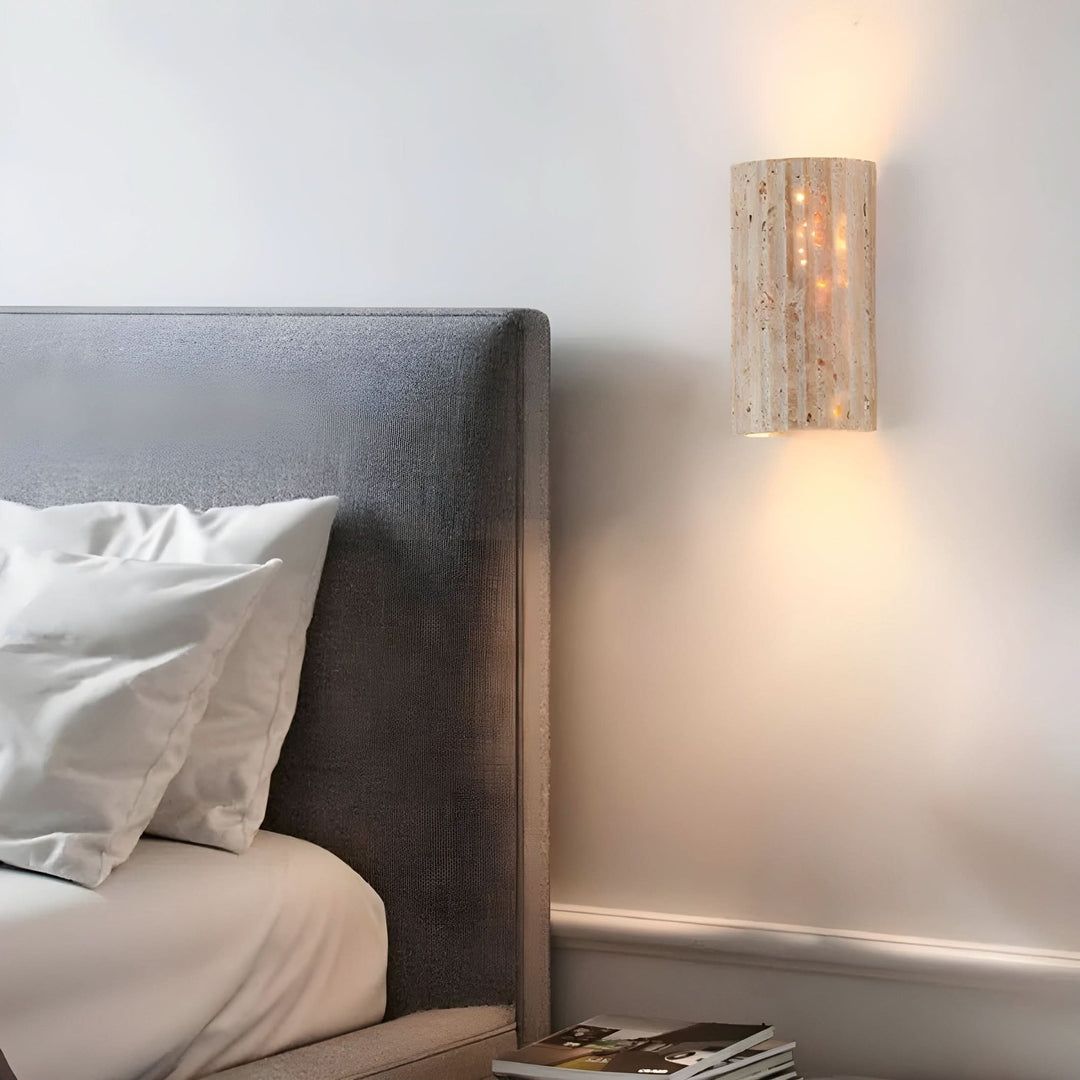 "Natural stone wall lamp with warm LED glow, showcasing organic texture and ambient lighting for modern interiors."