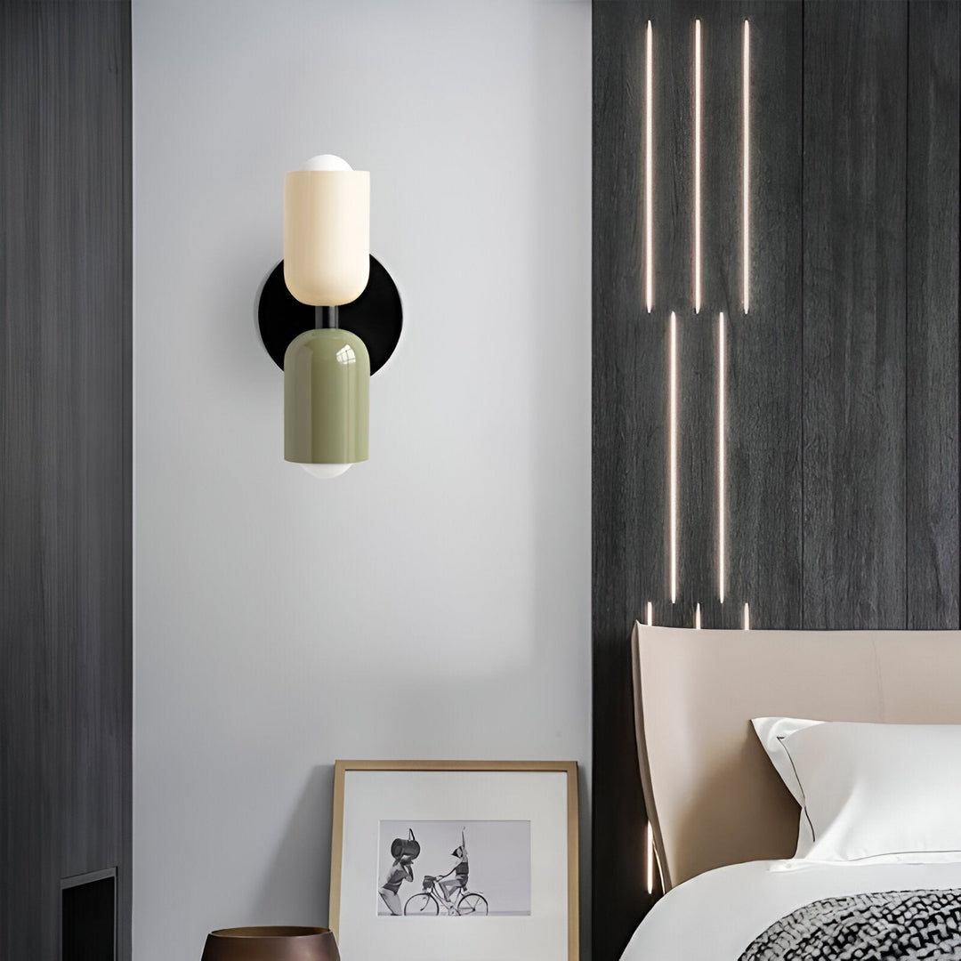 Nordic colourful double head wall light in vibrant colors, painted iron, sleek cylindrical design, casts light up and down.