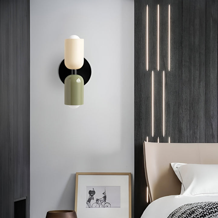 Nordic colourful double head wall light in vibrant colors, painted iron, sleek cylindrical design, casts light up and down.