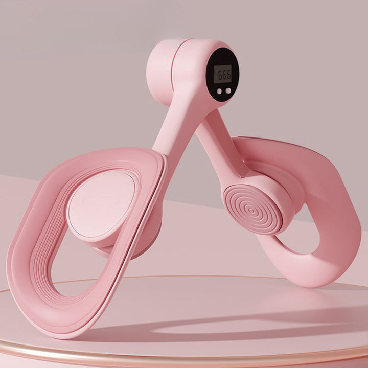 Pink adjustable pelvic and thigh trainer, compact design with digital counter, suitable for all fitness levels and portable.