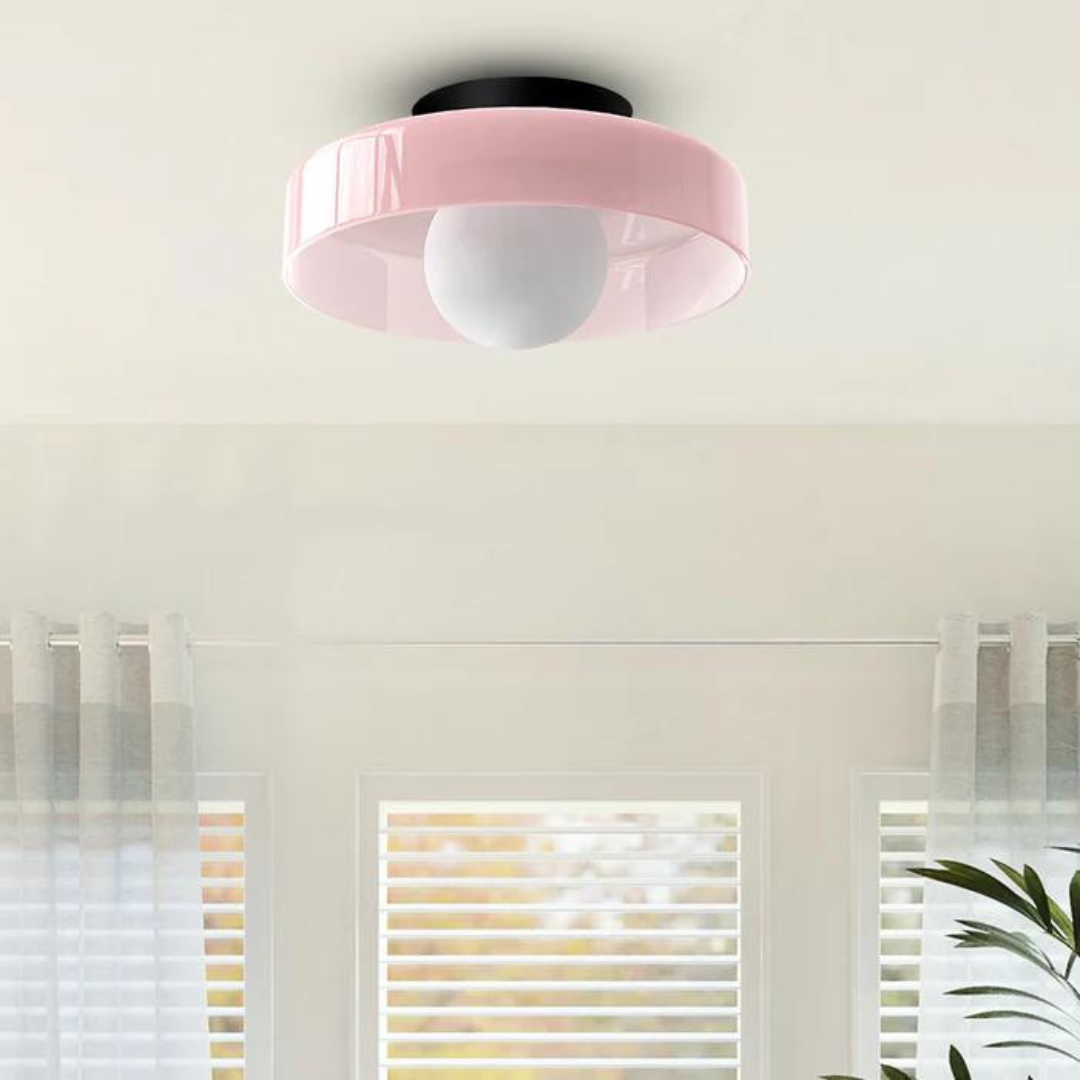 "Round ceiling lamp of high-quality glass in vibrant orange, stylish design, perfect for modern interiors, enhancing any spac