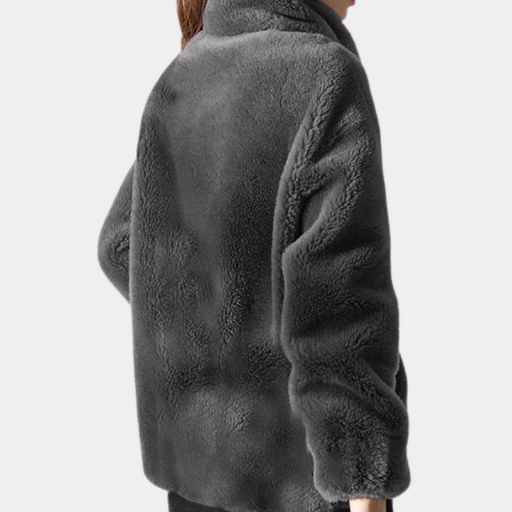 "Stylish women's warm jacket, grey, zip closure, premium polyester, elegant design, versatile fit for the chilly season."