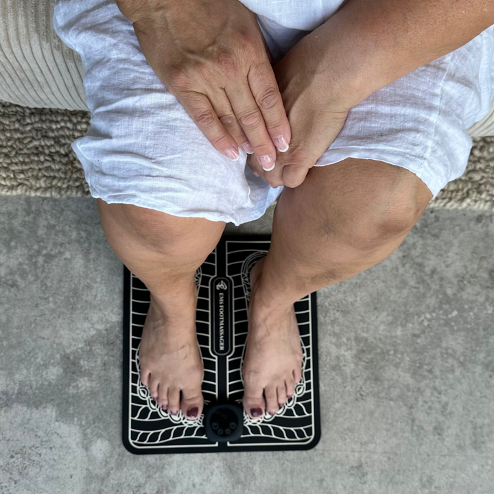 "Unisex EMS foot massager with a sleek design, showcasing six massage modes and portability for pain relief and relaxation."