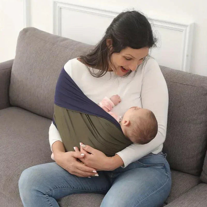 "Unisex ergonomic baby wrap carrier, grey, enveloping baby and parent comfortably for hands-free convenience."