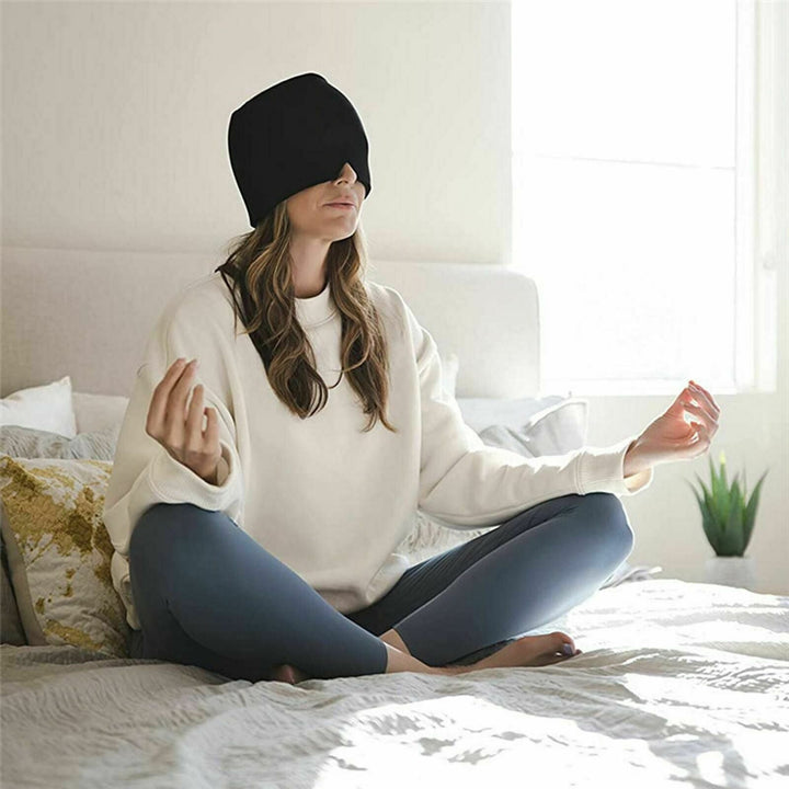 Unisex migraine relief cap in black, offers hot and cold therapy, soft fabric, covers eyes, designed for headache relief.
