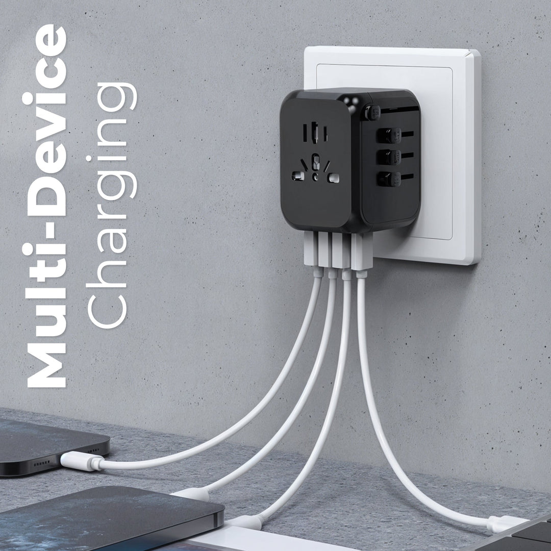 "Universal travel adapter, compact black design, with USB ports and global plug compatibility for 150+ countries."