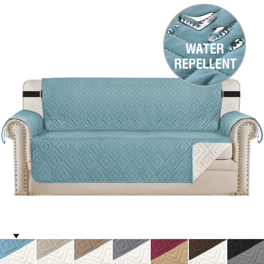 "Water-repellent non-slip reversible sofa cover protecting couch from spills and stains with pet sitting on it"