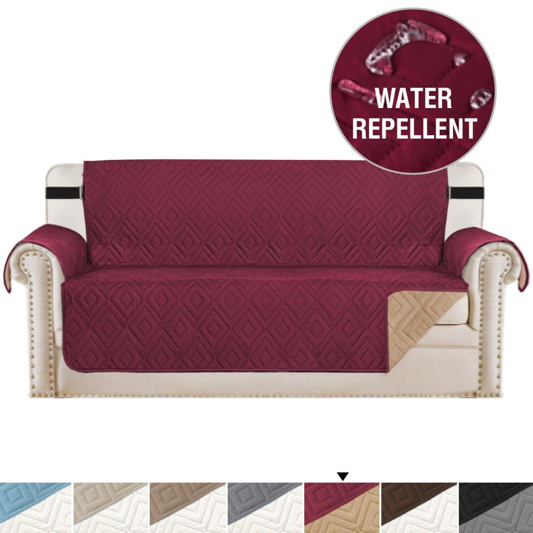 "Water-repellent non-slip reversible sofa cover protecting couch from spills and stains with pet sitting on it"