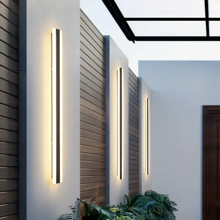 "Weather-resistant outdoor wall lamp, sleek modern design, waterproof, illuminating patios and gardens with warm white light.