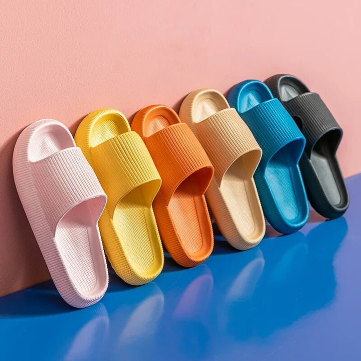 Women's Luxe Platform Cloud Slippers in vibrant hues with cushioned soles, non-slip design for indoor comfort and style.