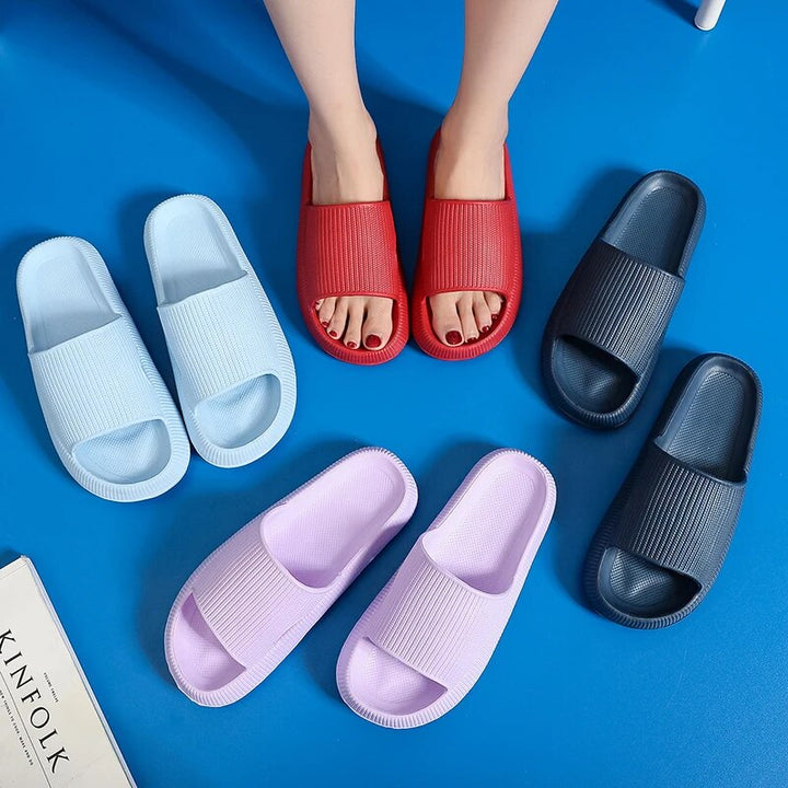 Women's Luxe Platform Cloud Slippers in vibrant hues with cushioned soles, non-slip design for indoor comfort and style.